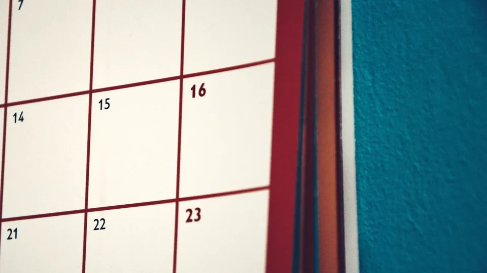A wall calendar grid with a few dates visible